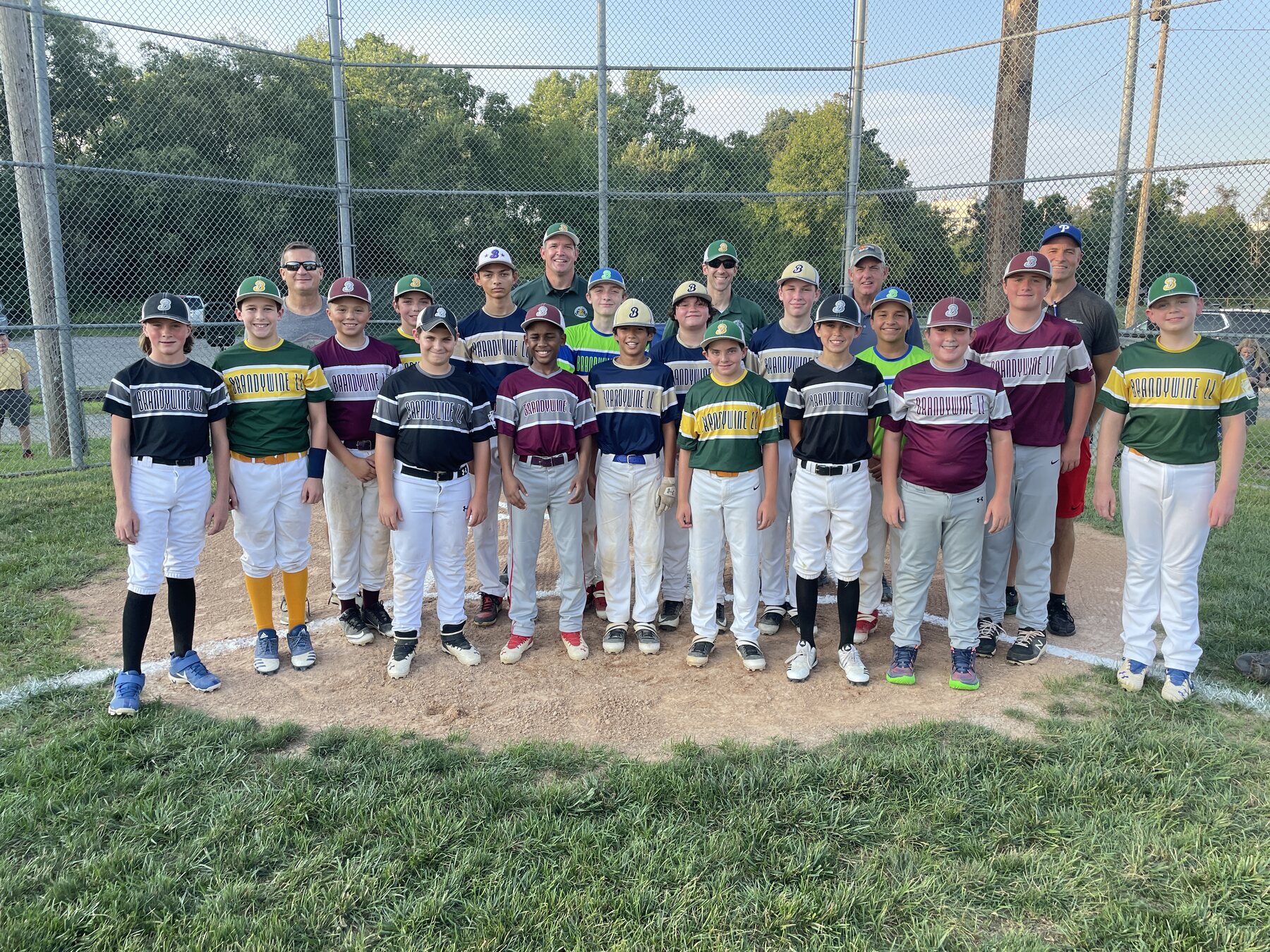 The 2021 Brandywine Little League graduates and coaches together on the field