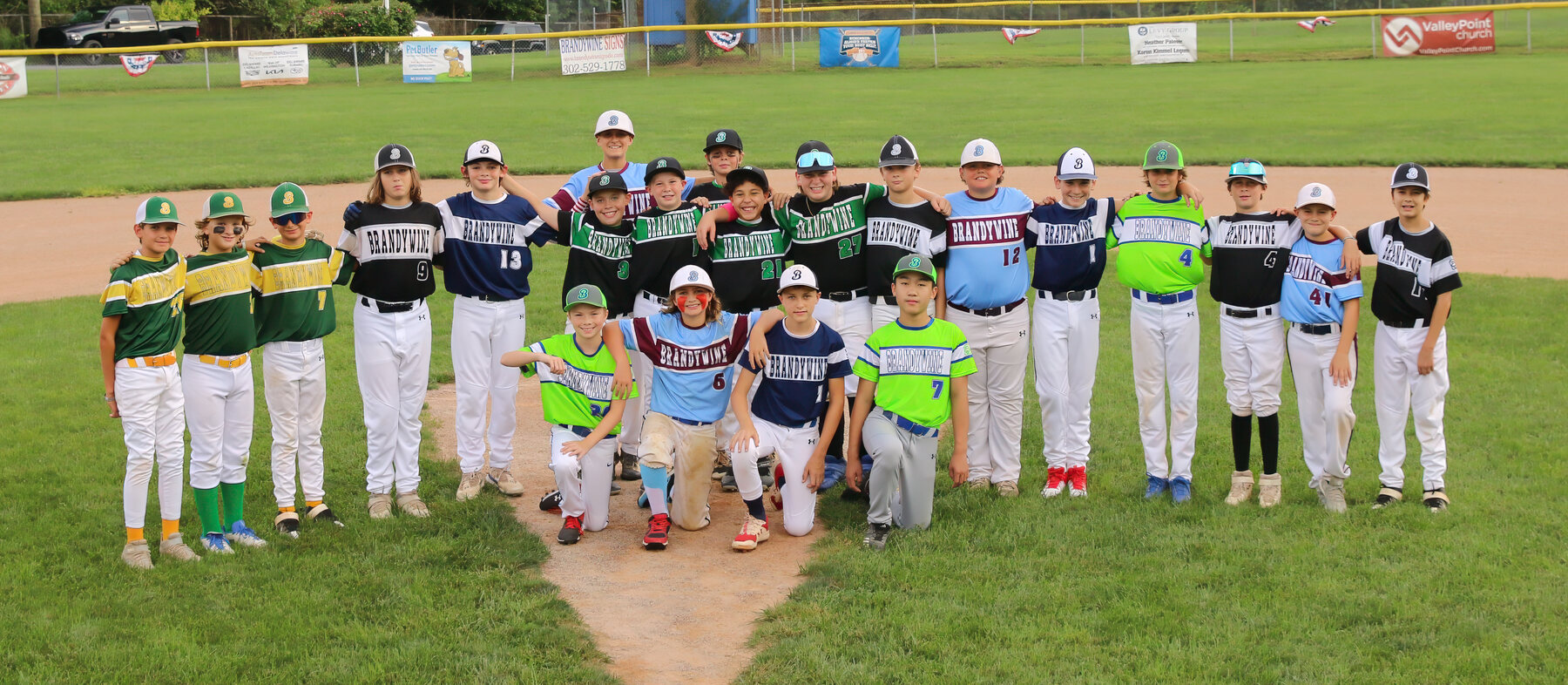 The 2023 Brandywine Little League graduates and coaches together on the field
