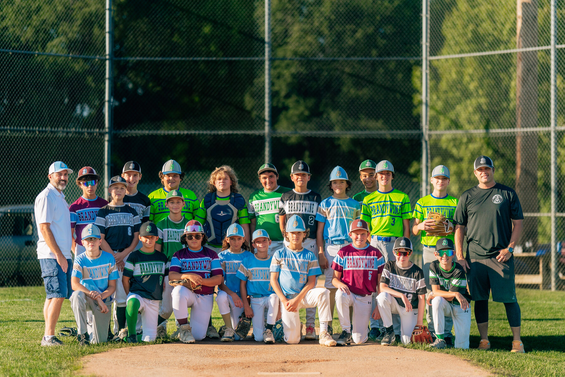 The 2024 Brandywine Little League graduates and coaches together on the field